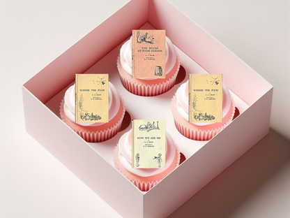 Cupcakes with book-themed packaging in a pink box