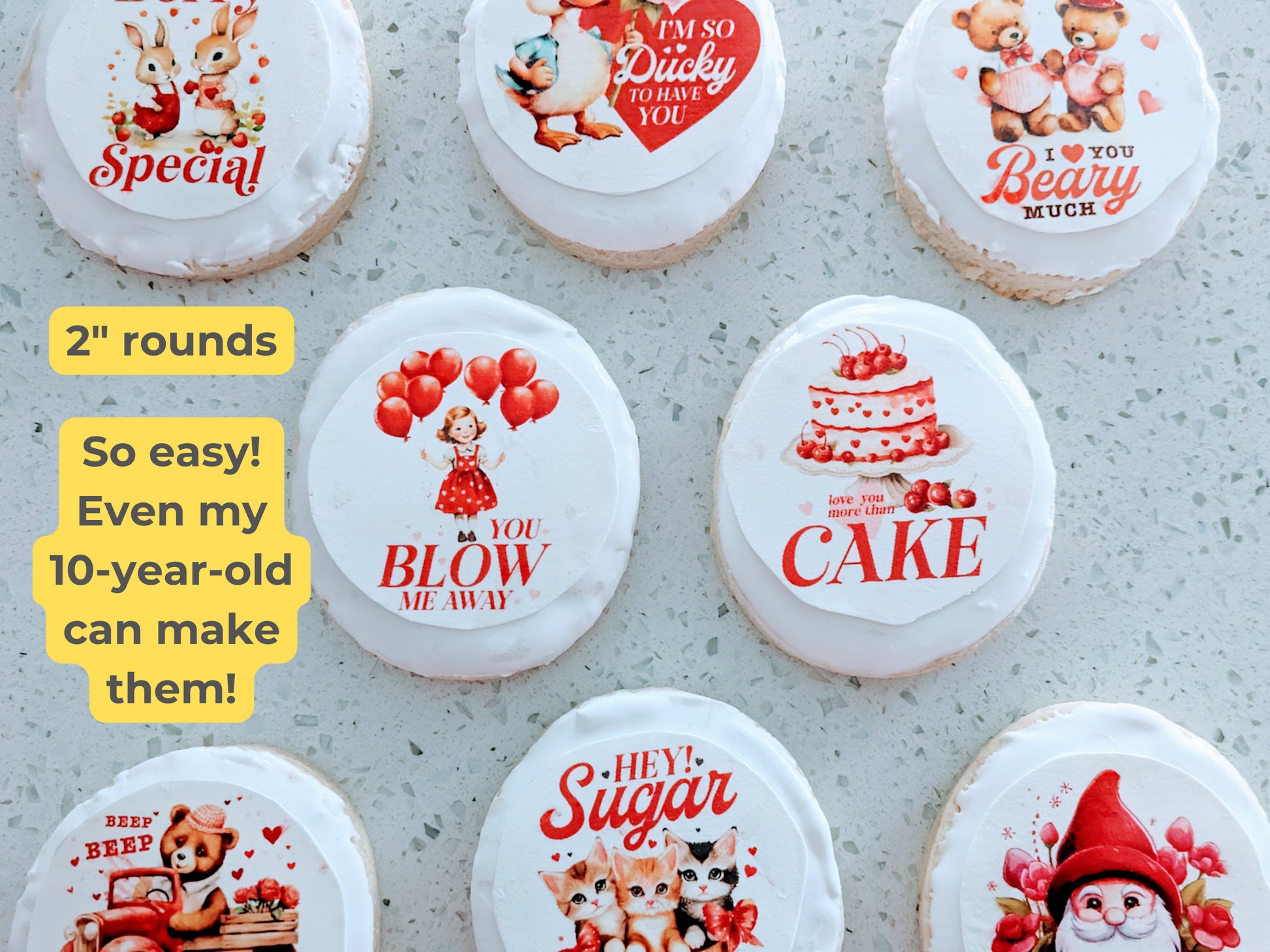 Decorative cookies with various designs and text on a gray surface