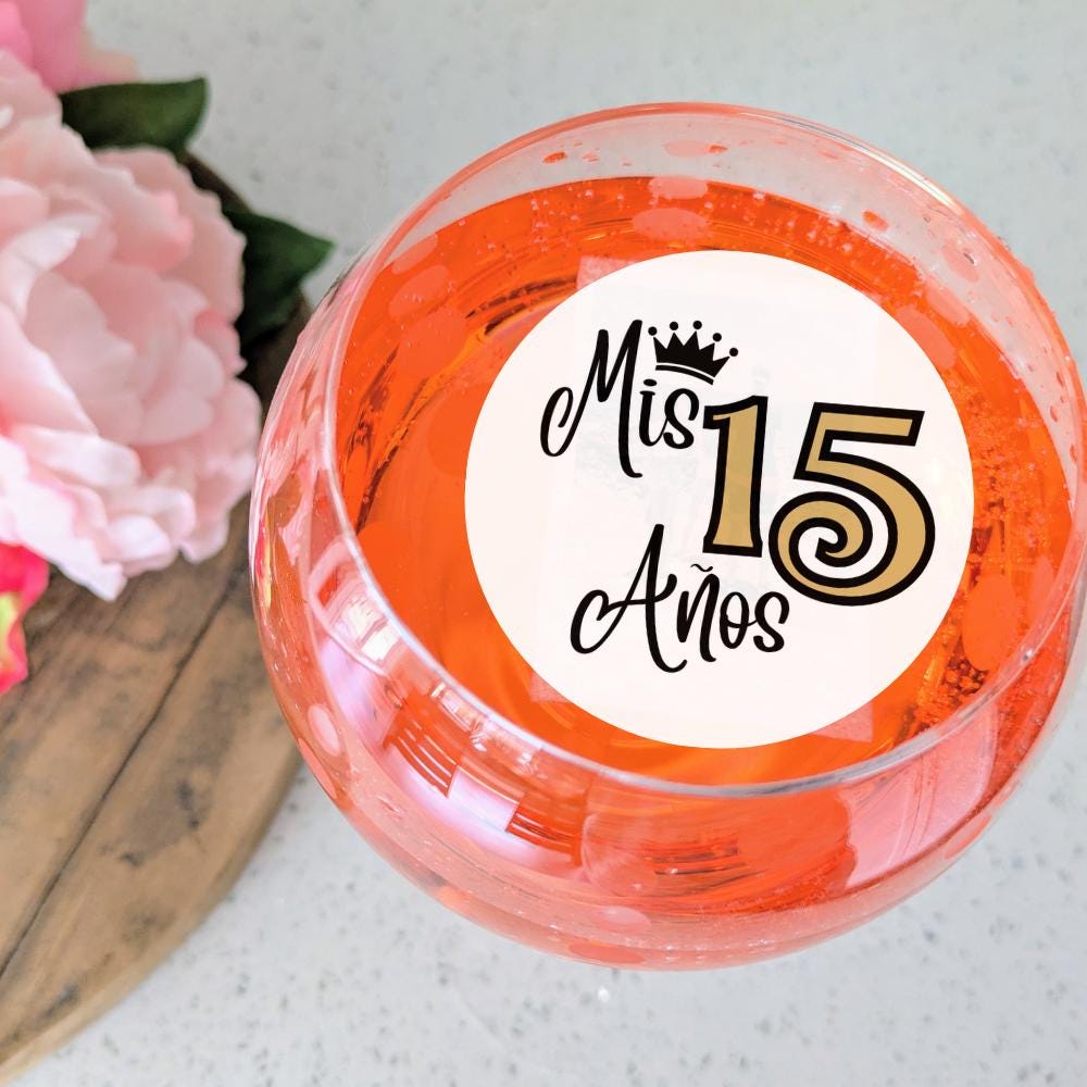 Birthday Quinceañera cocktail garnish with 'Mis 15 Años' text on a white background