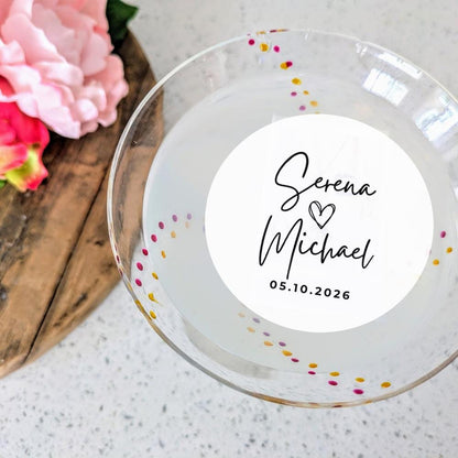 Personalized wedding cocktail topper with names and date on a light background