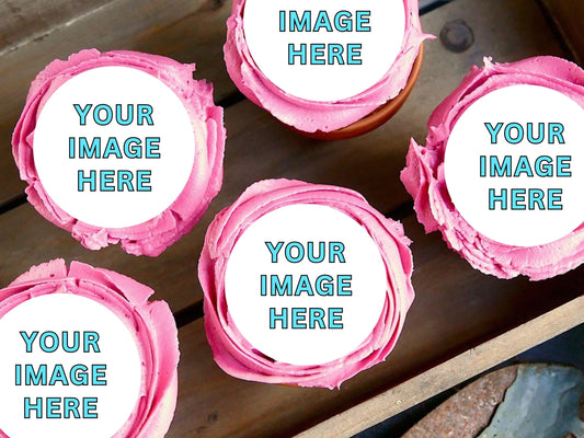 Pink frosted cupcakes with customizable images on a wooden surface